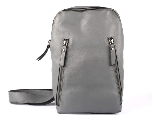 Gray leather sling backpack with two zippered pockets.