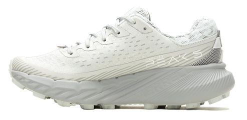 a side-profile view of a light grey athletic shoe with a thick textured sole.