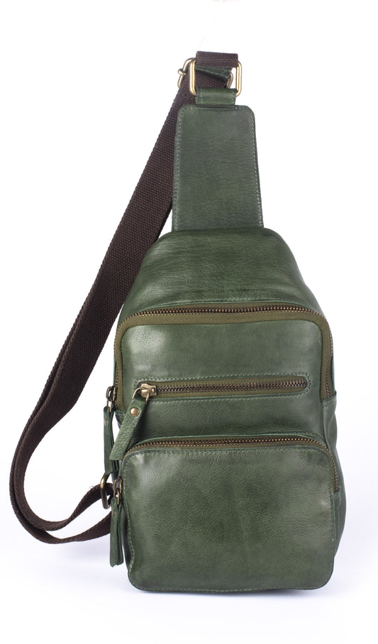 Olive-green leather sling backpack with two zipped pockets and a brown strap.