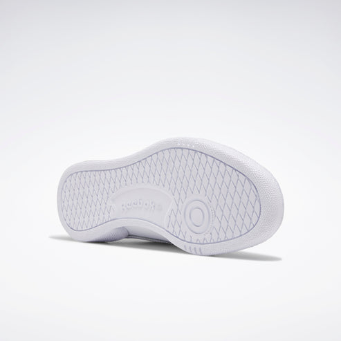 White shoe sole featuring a circular pattern and "Reebok" text.
