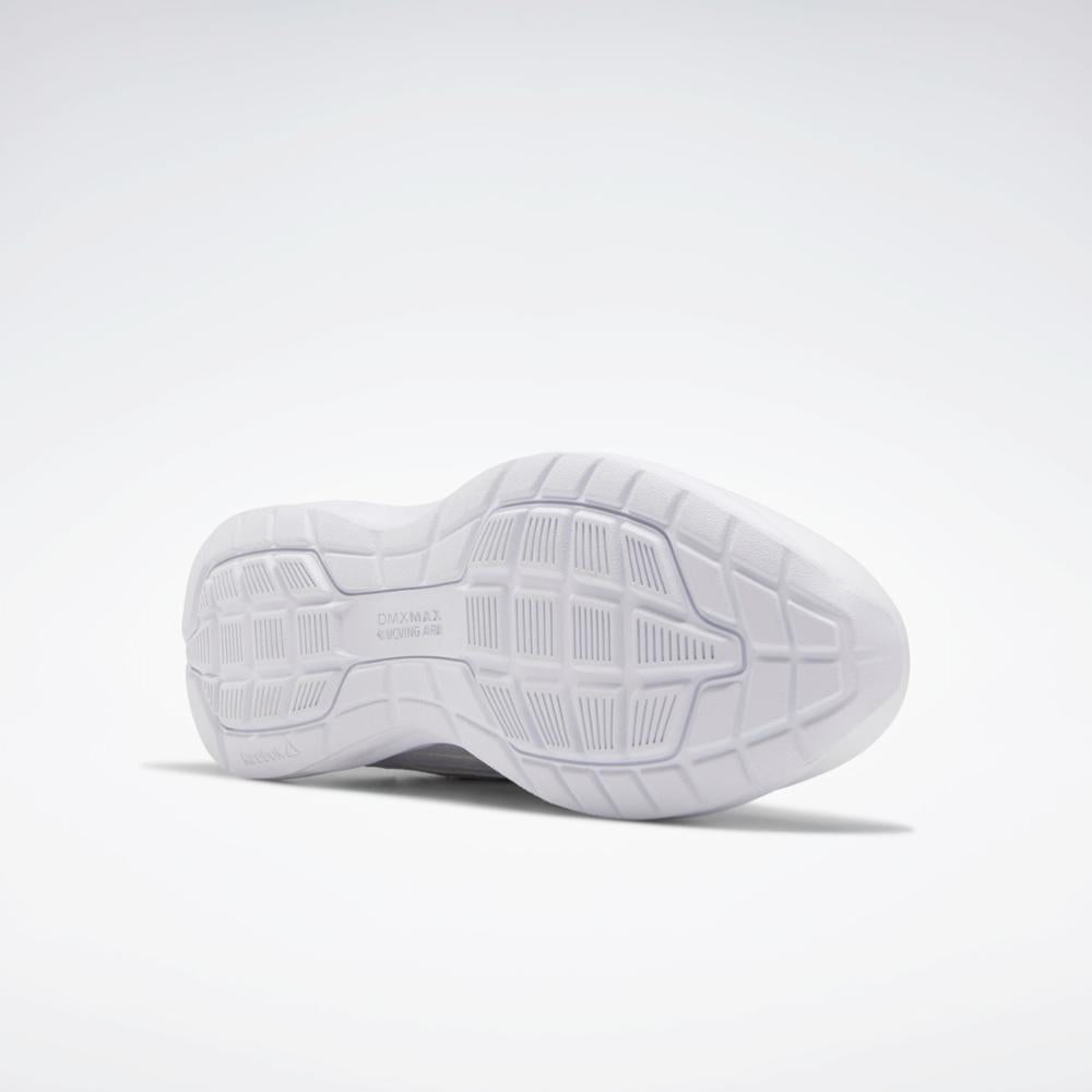 White running shoe outsole with tread pattern.