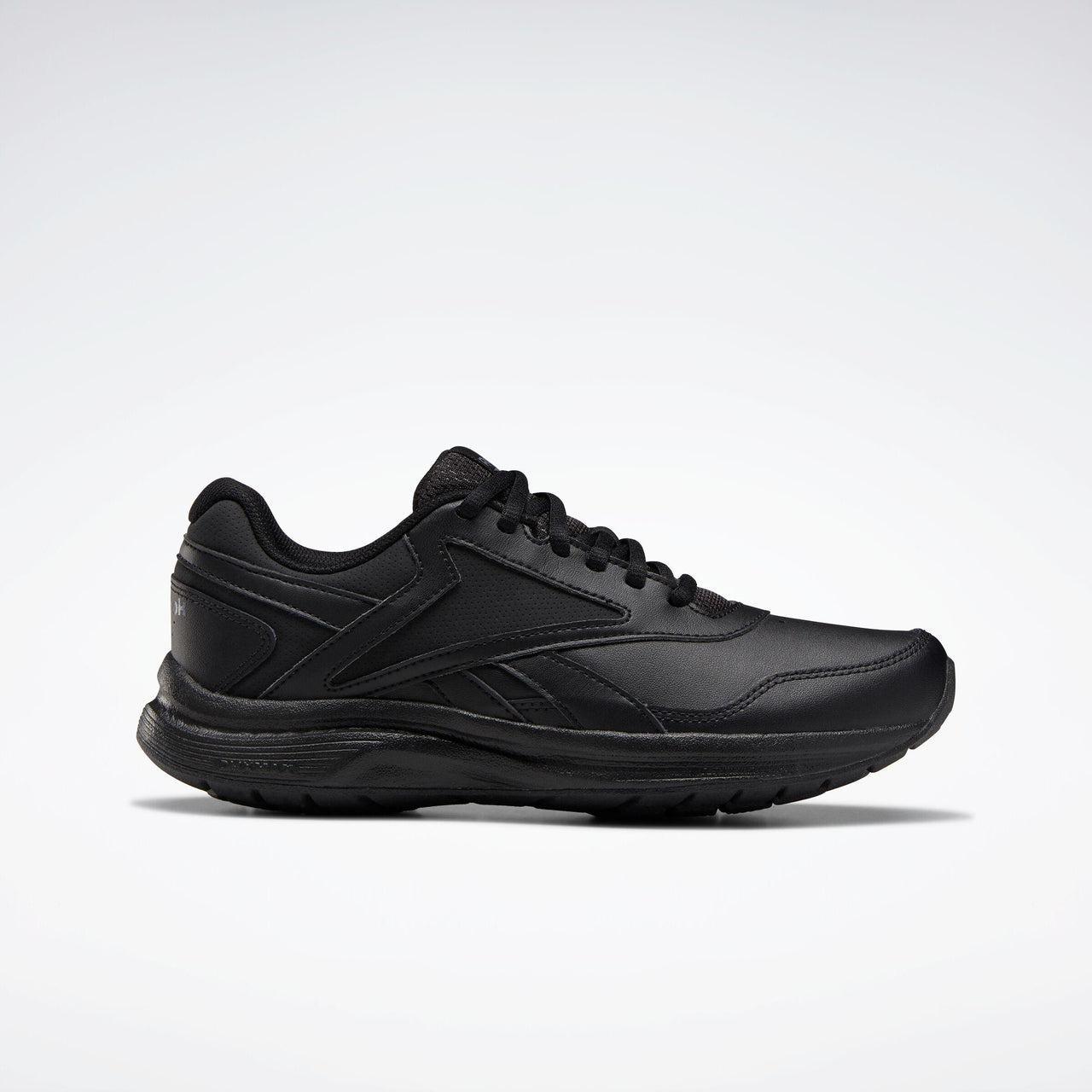 All-black leather athletic shoe with dark laces and a thick sole.