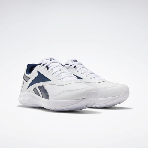 Pair of white athletic shoes with navy blue accents.