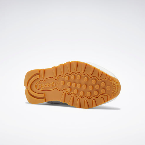 Brown outsole with a round heel and logo.