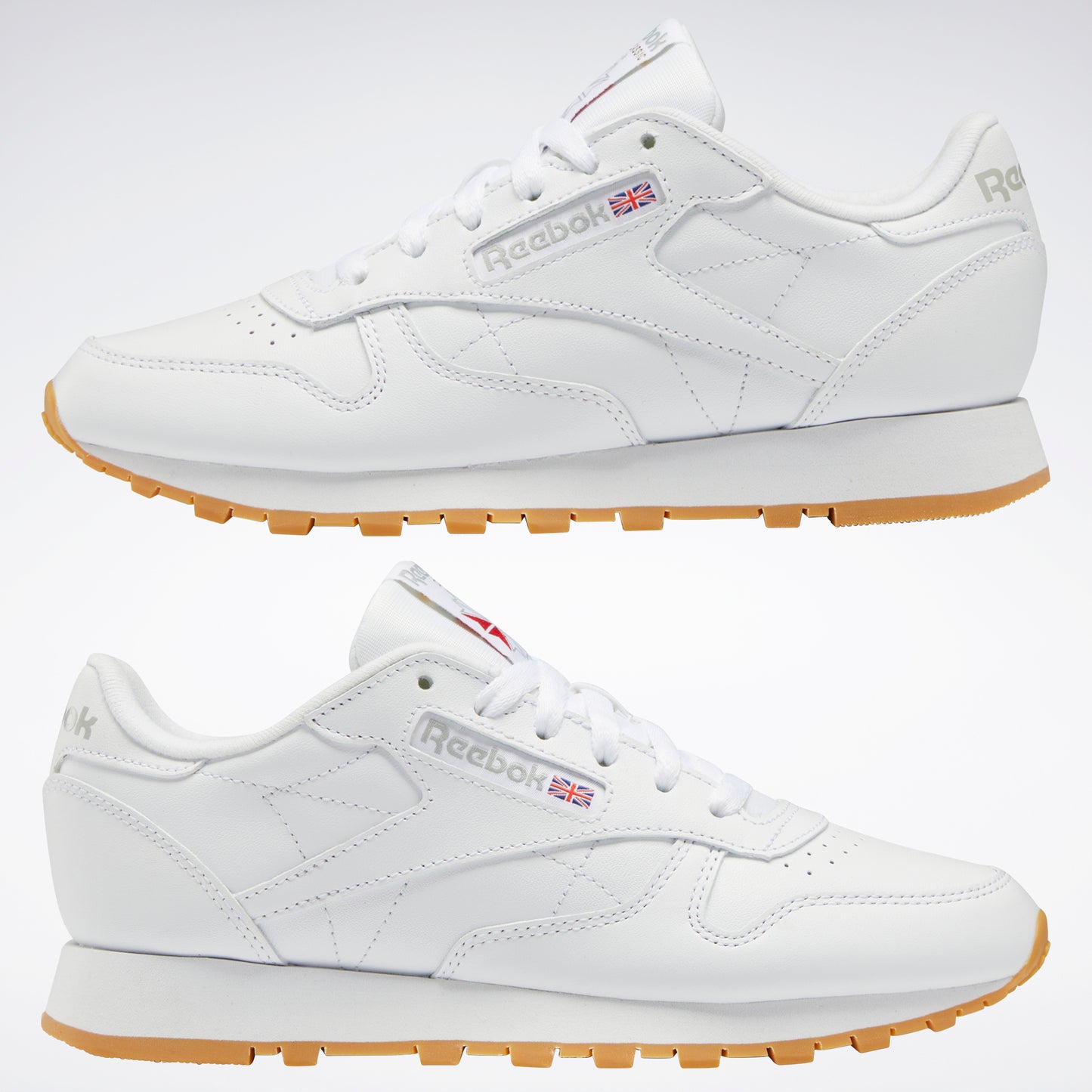Two white leather sneakers with a gum sole.