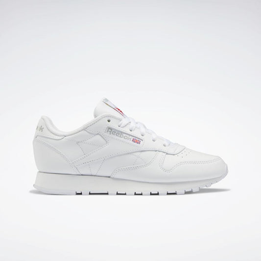 White low-top sneaker with red logo.