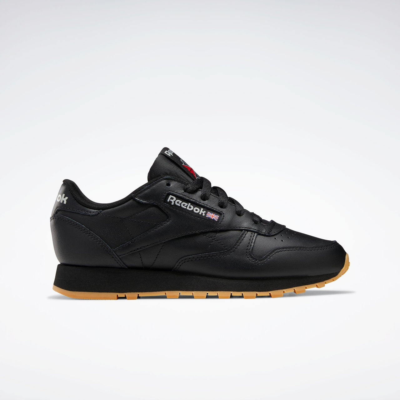 Black leather athletic shoe with brown sole.