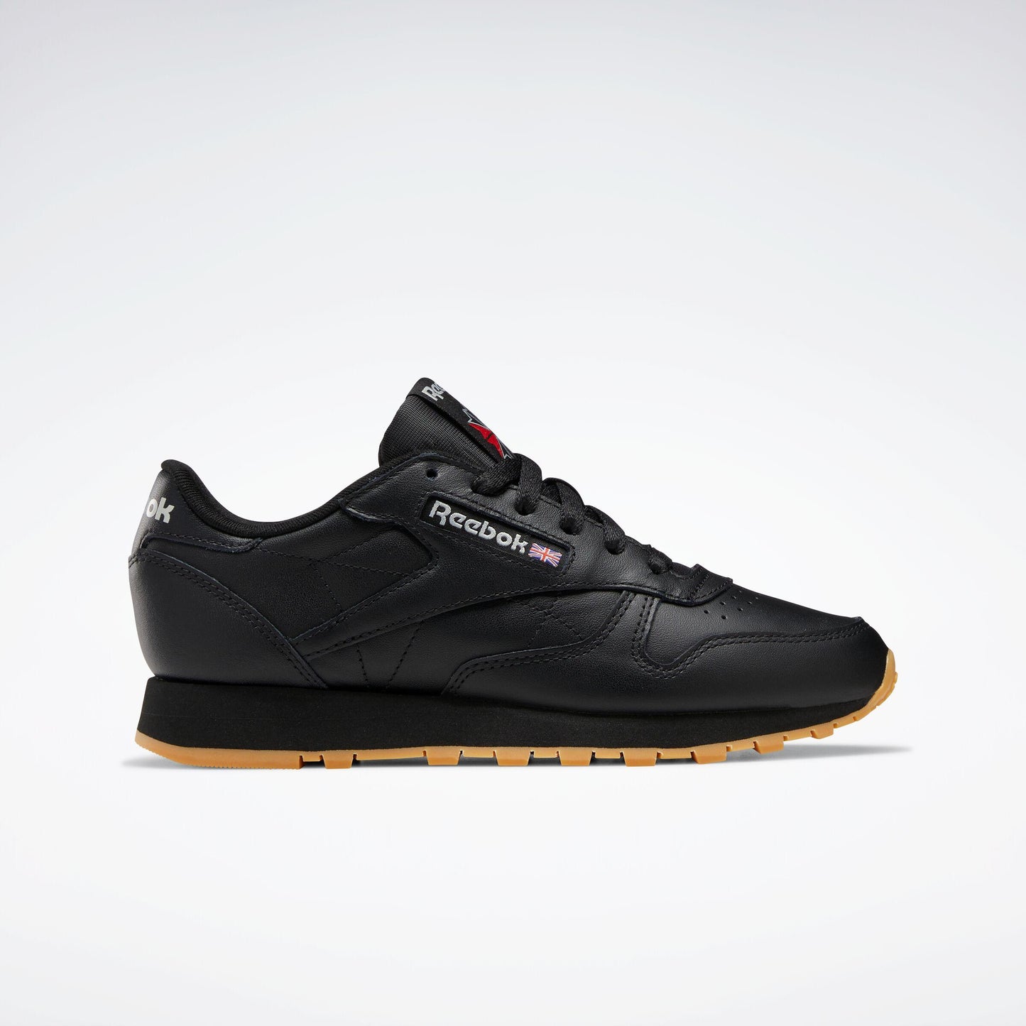 Black leather athletic shoe with brown sole.
