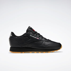 Black leather athletic shoe with brown sole.