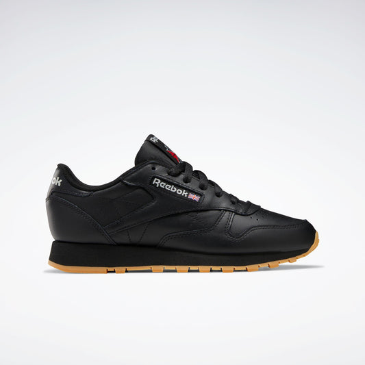 Black leather athletic shoe with brown sole.