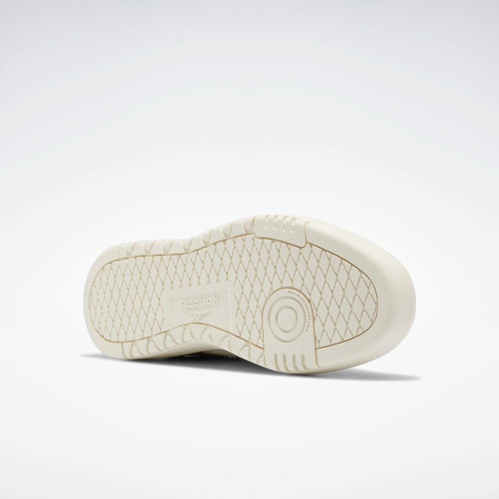 Off-white shoe sole featuring a circular tread pattern on the heel and a diamond pattern on the remainder of the sole.