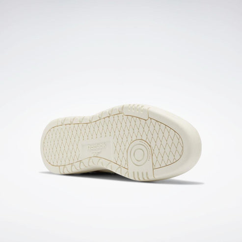 Off-white shoe sole featuring a circular tread pattern on the heel and a diamond pattern on the remainder of the sole.