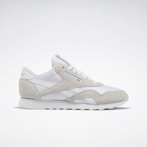 White sneaker with suede overlays and rubber sole.