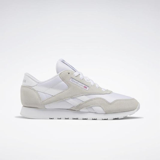 White sneaker with suede overlays and rubber sole.