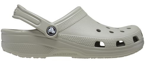 Beige clog style shoe with heel strap.