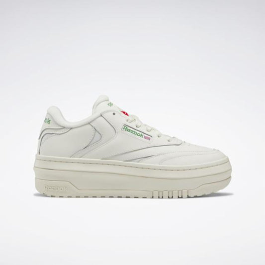 Off-white platform sneaker with a thick sole, branding near the laces, and a slightly raised heel.