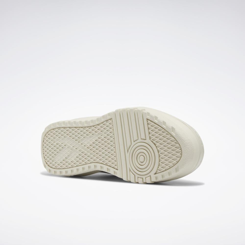 Beige sole with concentric circles and diamond pattern.