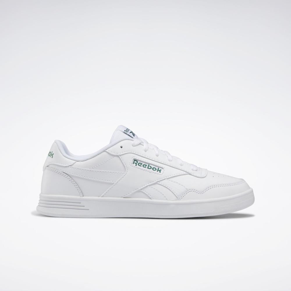 White sneaker with the word "Reebok" on the side.