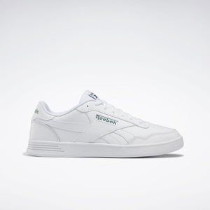 White sneaker with the word "Reebok" on the side.