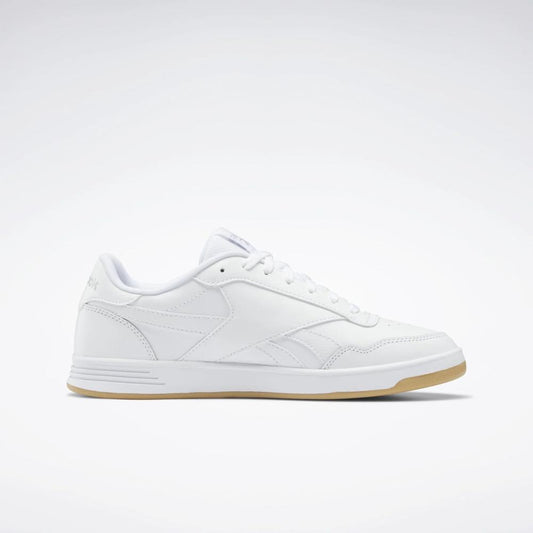 A low top, white sneaker with a brown gum sole.