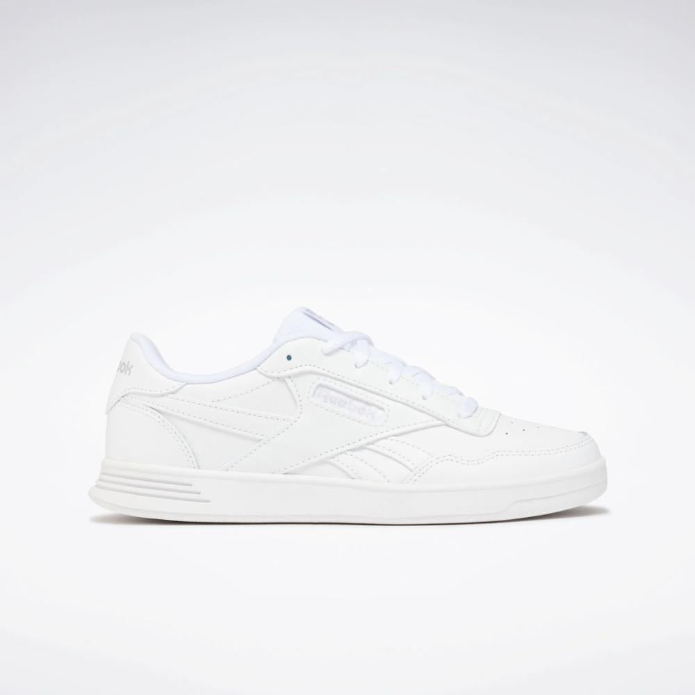 White low-top sneaker with a flat sole and lace-up closure.
