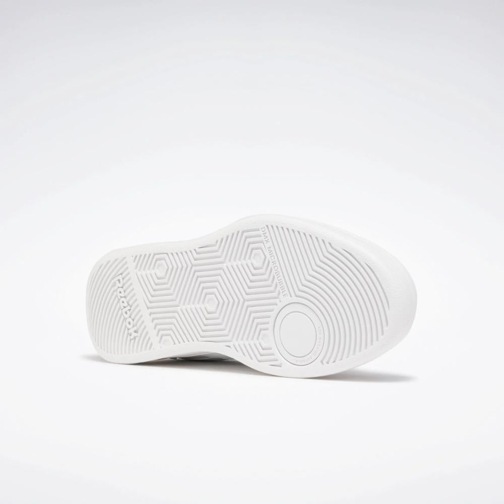 White shoe sole with circles and hexagons.