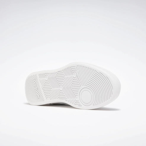 White shoe sole with circles and hexagons.
