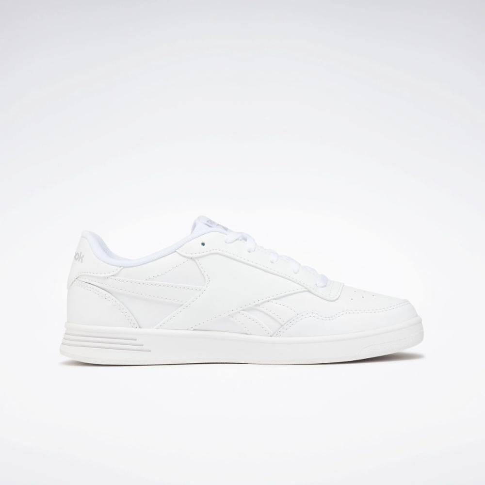 A white sneaker with a flat sole.