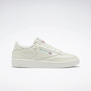 Off-white low-top sneaker with white sole and laces.