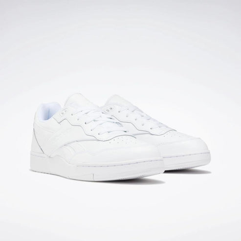Low-top white sneakers with white laces.