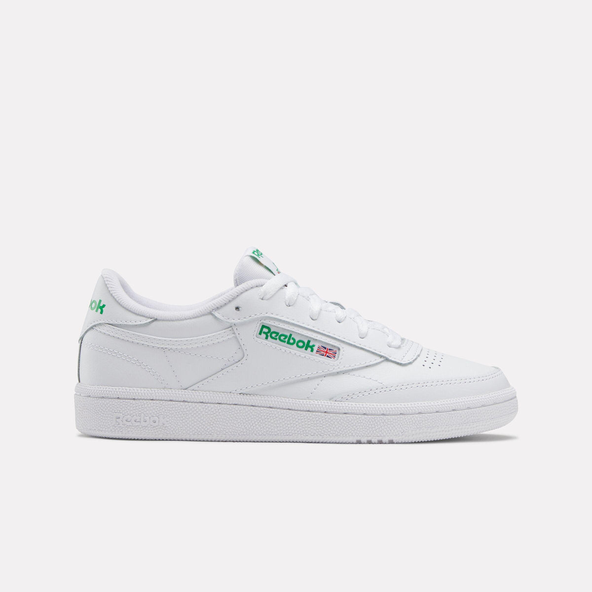White sneaker with a green logo.