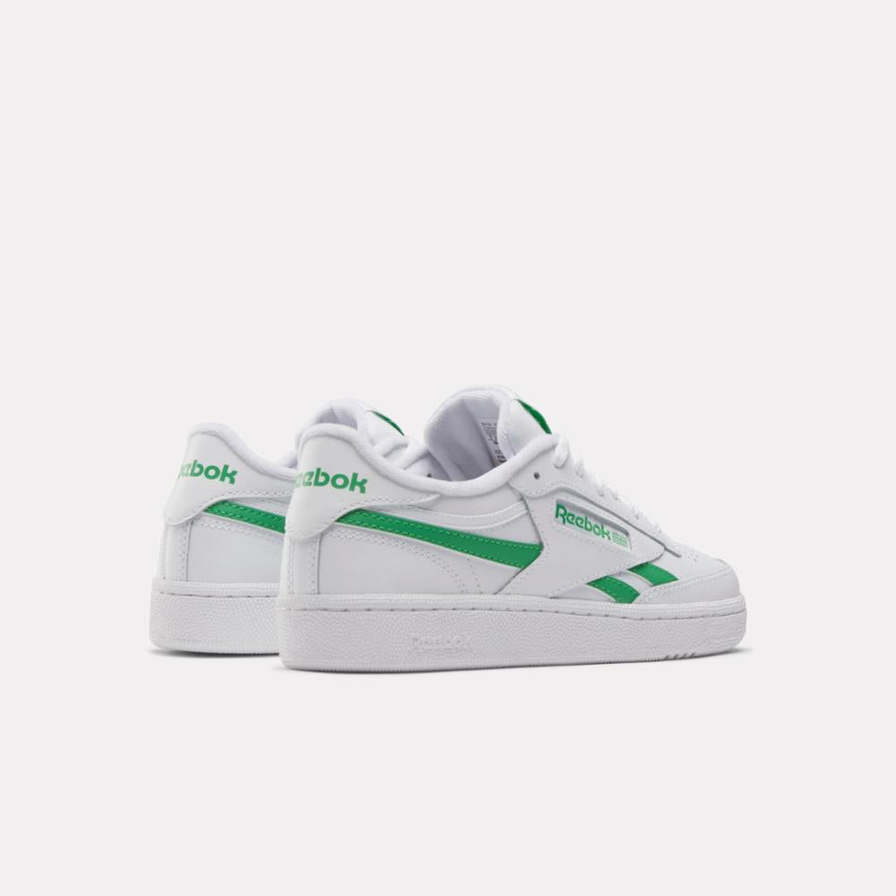white tennis shoes with green stripes