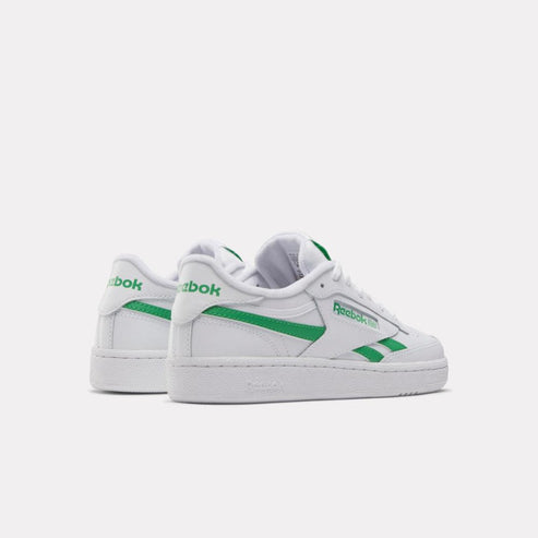 white tennis shoes with green stripes