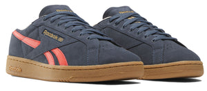 A pair of low-top blue leather sneakers with coral stripes and gum soles.