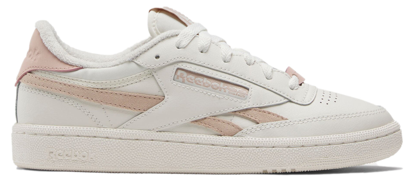 A white and light pink shoe with laces.