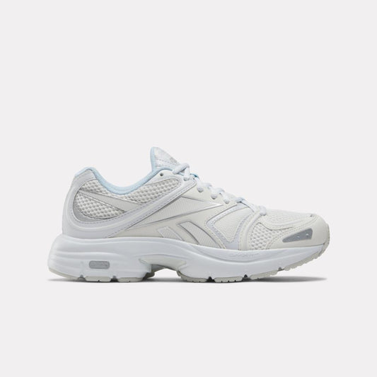 White sneaker with a mesh upper and a chunky sole.