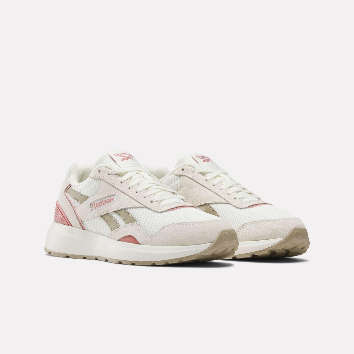 Off-white athletic shoes with pink and beige accents.