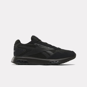 Black sneaker with the text Reebok in black on the side.