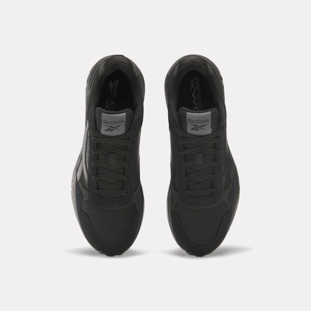 Top view of two black running shoes with Reebok logo on tongue.