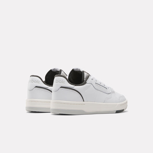 Low-top white sneakers with gray accent.