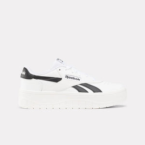 White low-top platform sneaker with black accents.