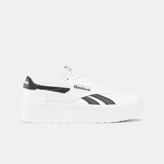 White low-top platform sneaker with black accents.