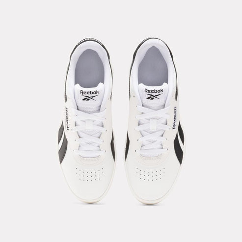 Top-down view of two white shoes with black trim and white laces; "Reebok" printed on side and on tongue.