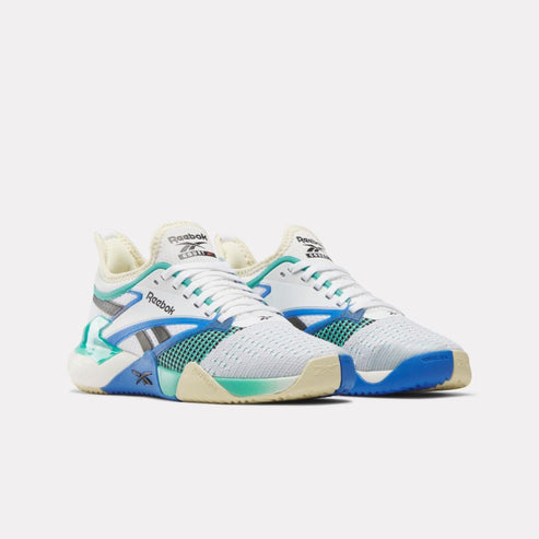 Pair of white athletic shoes with blue and green accents.