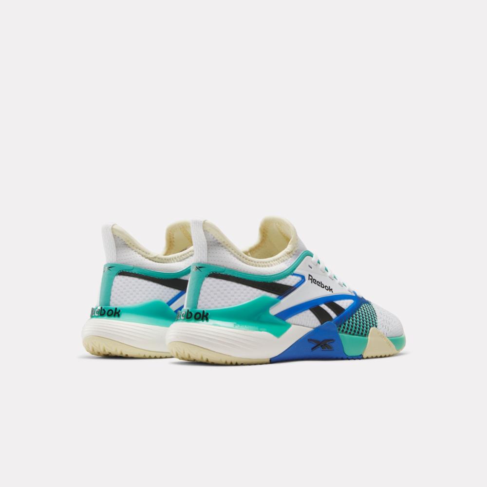 Pair of white, teal and blue athletic shoes, rear view.