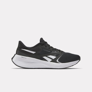 A black running shoe with white accents and a thick white sole.