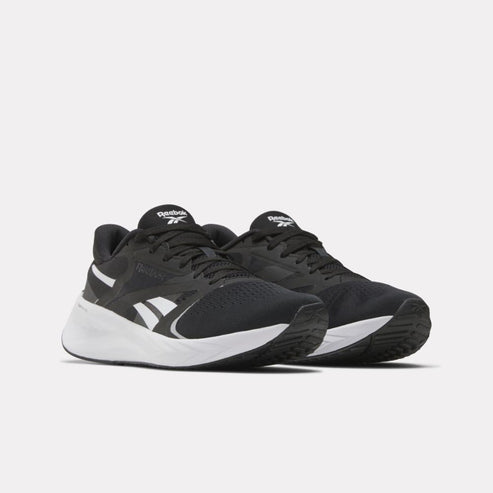 Pair of black and white running shoes with mesh upper and curved sole.