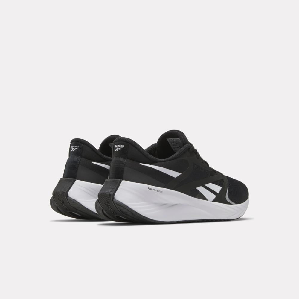 Pair of black and white running shoes, viewed from the back at a slight angle.