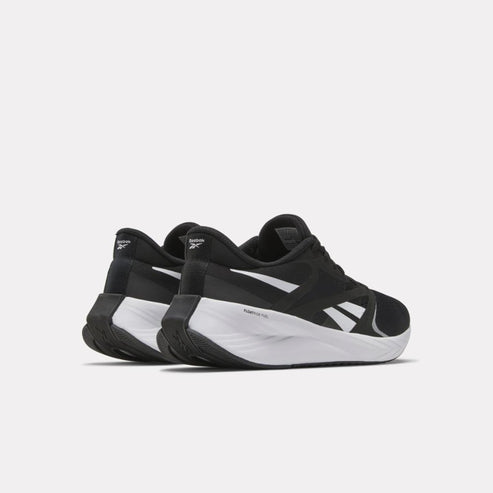 Pair of black and white running shoes, viewed from the back at a slight angle.