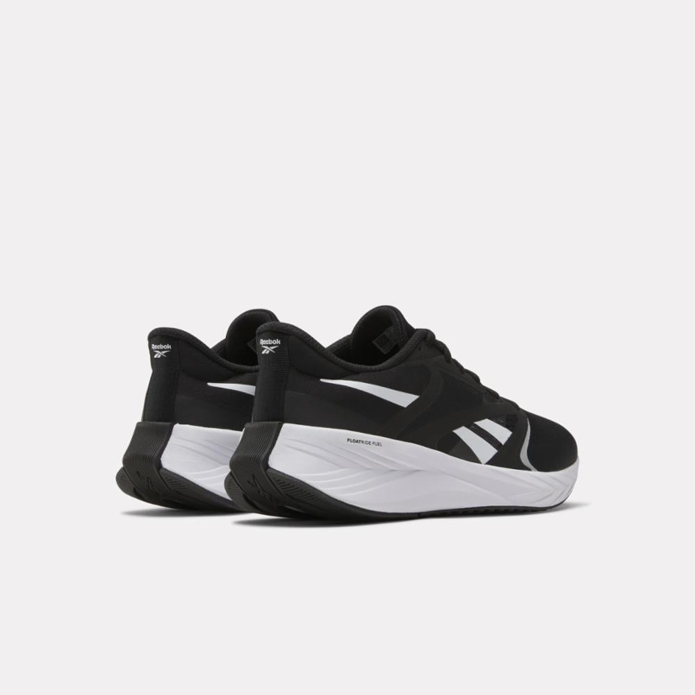 Close-up rear view of black sneakers with white side stripes and soles.
